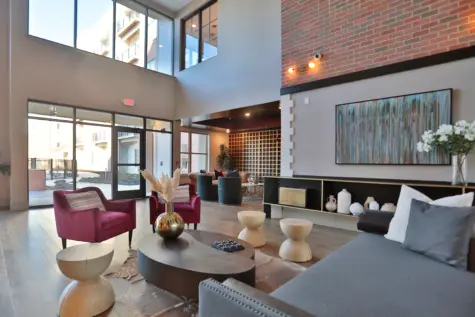 Clocktower West Chester Apartments clubhouse area. Seated options and a view of the patio area.