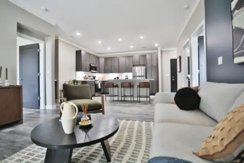 Living room, luxury living space and view of kitchen area Altair Apartments in Florence, KY