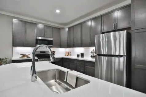 Up close of modern kitchen sink with quartz tops, Altair Apartments in Florence, KY.
