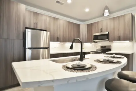 VAN Kitchen with beautiful kitchen countertops, with seated bars, quartz countertops at Vantage at Anderson Towne Center