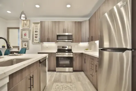 VANkitchen, modern kitchen with wood floors and quartz countertops of Vantage at Anderson Towne Center