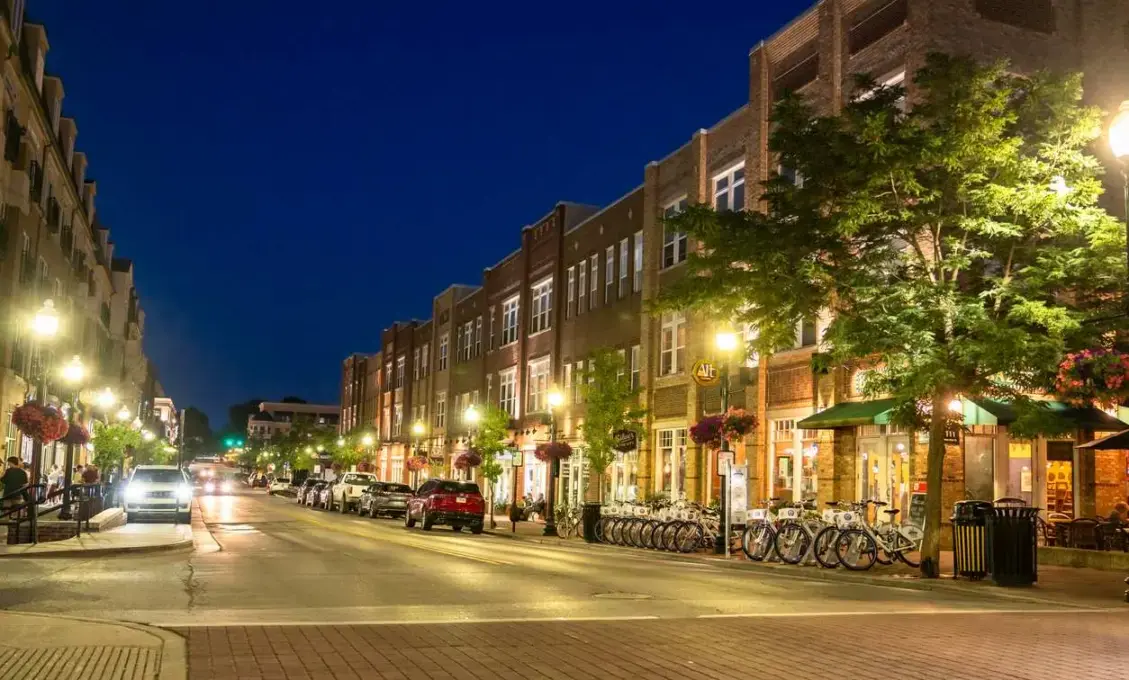 A night street scene in Carmel, IN, near the Arts and Design District.