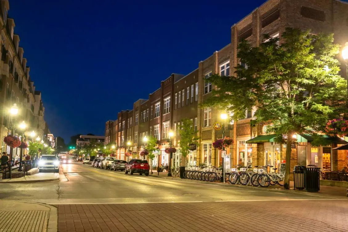 A night street scene in Carmel, IN, near the Arts and Design District.