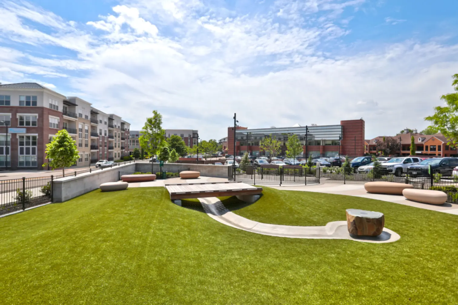 View of the newly developed Blue Ash Bicentennial Veterans Memorial Park near 49Hundred Apartments, showcasing the park’s landscaped grounds and a backdrop of the apartment exterior in a vibrant community setting.