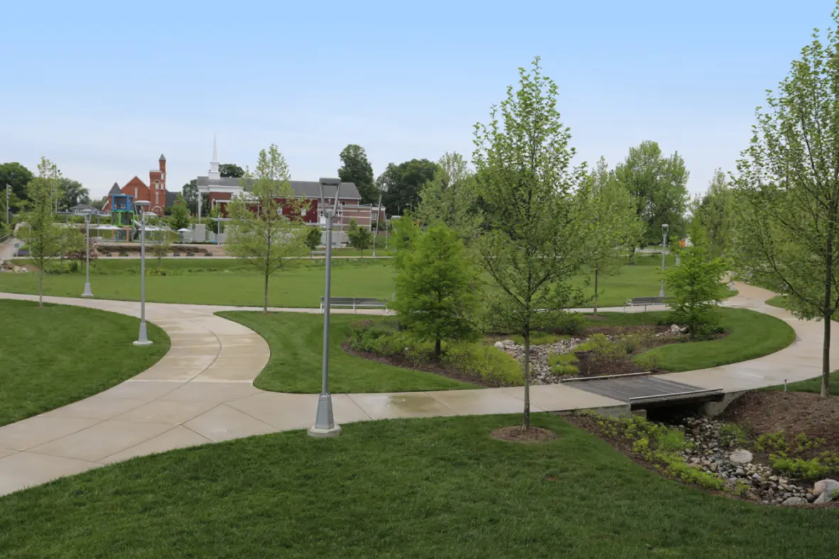 Photo of a local park in Greenwood, Indiana, located just minutes from Emerald Lakes Apartments, featuring open green space, mature trees, walking paths, and a peaceful natural setting.