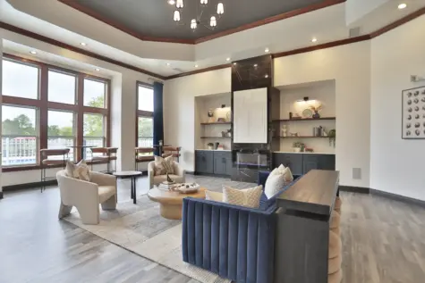 Another angle of the clubhouse at Wellington Place Apartments showcasing contemporary seating areas, stylish décor, and open layout perfect for relaxing or entertaining.