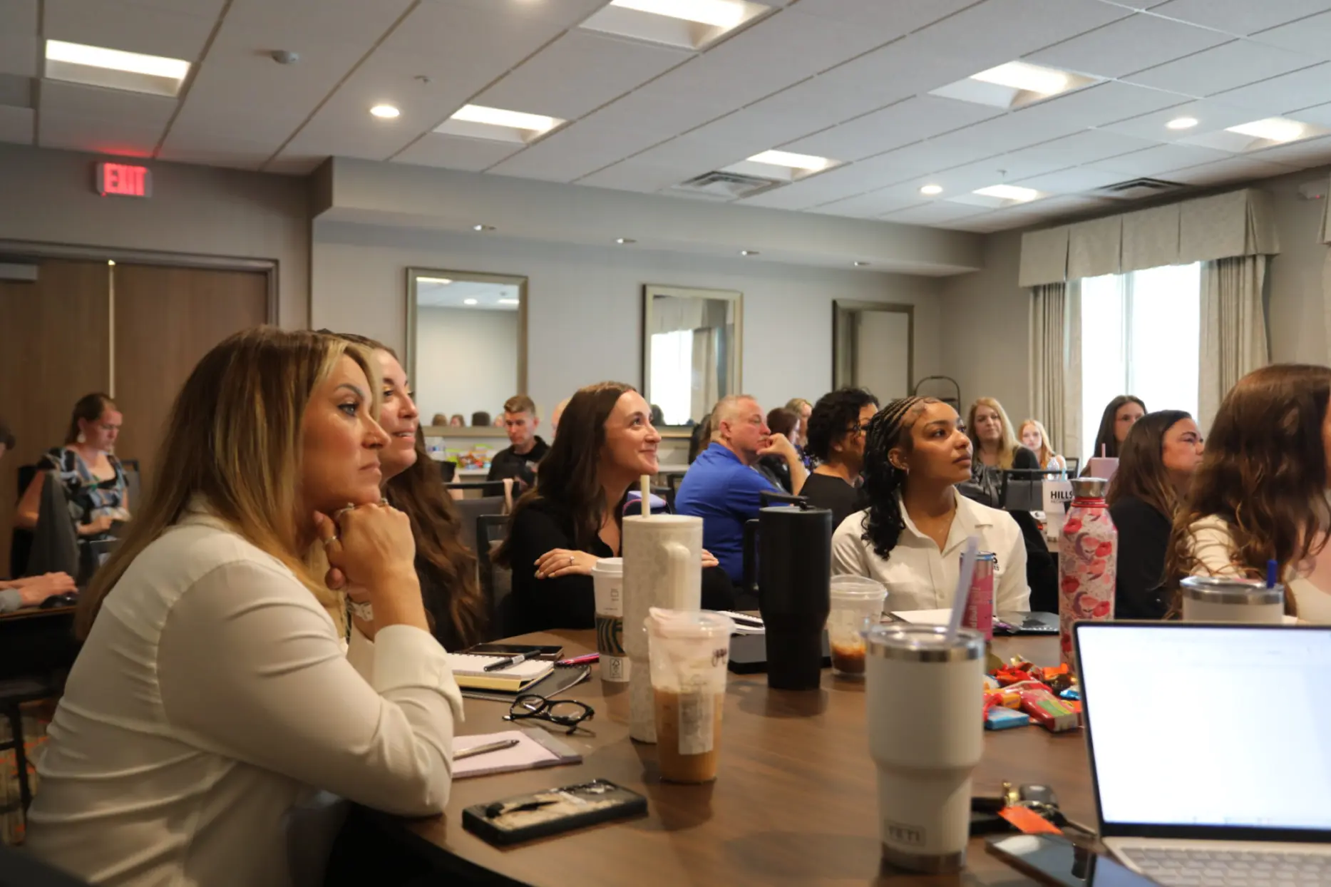 2025 Leadership Summit, HILLS Business Manager sit in a session.