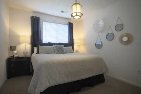 Reserve at Miller Farm primary bedroom with king-sized bed.