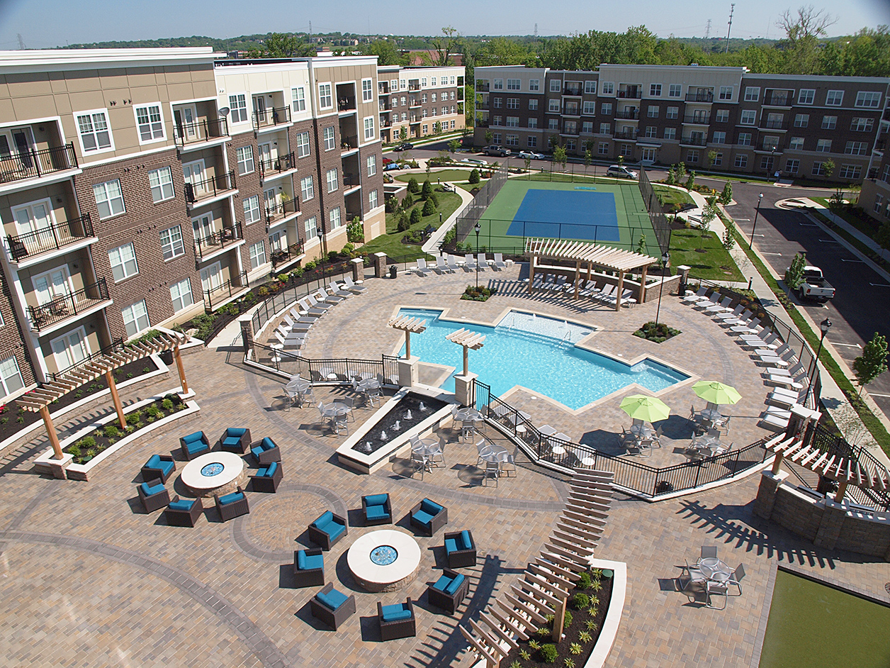 Exterior view Savoy at the Streets of West Chester including pool, lounge area, and tennis courts