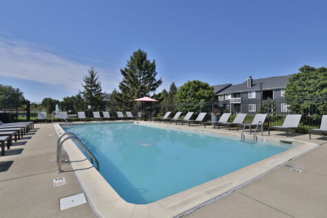 Lounge chairs and pool area at Wellington Place