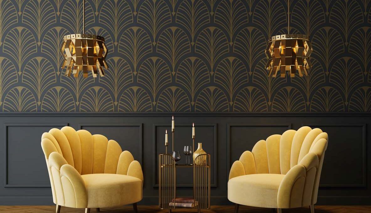 An Art Deco-inspired living room with yellow armchairs and lamps symmetrically settled in front of wallpaper.