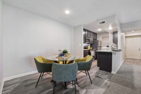 Dining area adjacent to open kitchen at Fox Chase South Apartments in Southgate, KY.