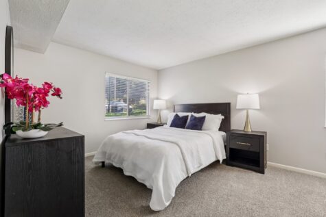 Primary bedroom with spacious closet and natural light at Fox Chase South Apartments in Southgate, KY.