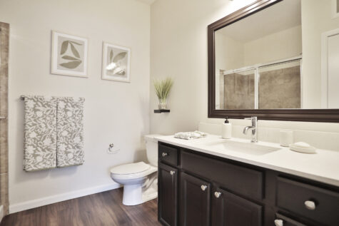 Private suite bathroom at Kendal on Taylorsville featuring a walk-in shower, modern vanity, and sleek fixtures.