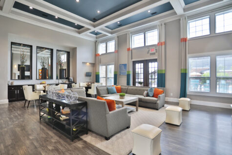 Clubhouse and leasing office at Kendal on Taylorsville featuring inviting lounge seating and a modern coffee bar, creating a warm and welcoming space for residents and guests.