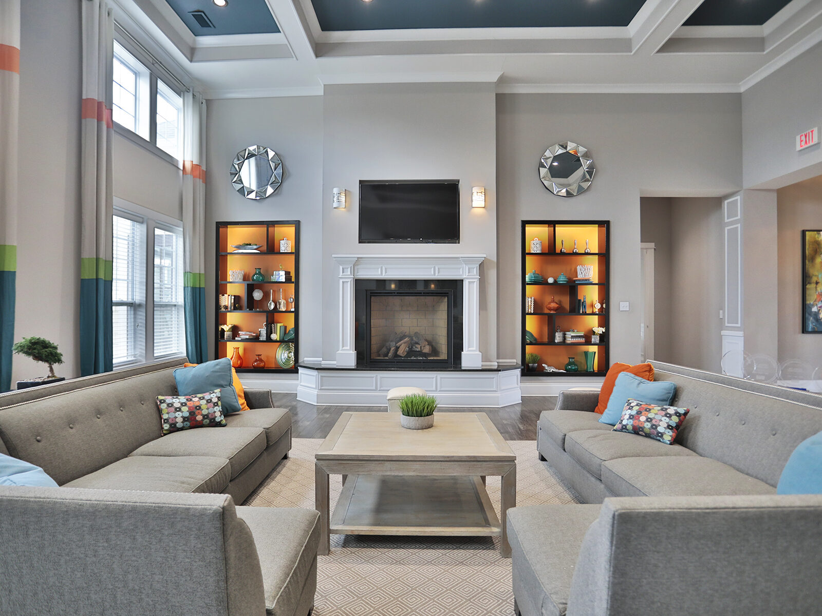 Clubhouse and leasing office at Kendal on Taylorsville featuring inviting lounge seating and a modern coffee bar, creating a warm and welcoming space for residents and guests.