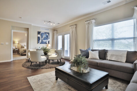 Spacious model home at Kendal on Taylorsville featuring a bright living space with seamless flow from the dining area to the kitchen, accented by contemporary finishes.