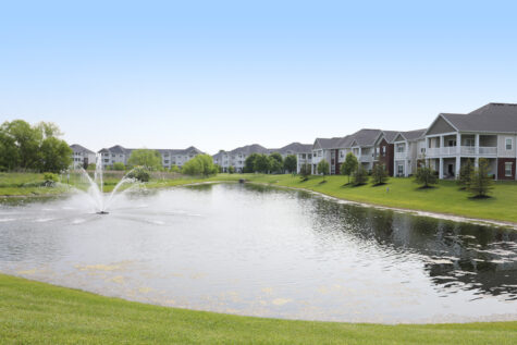 Palmera Apartments Pond Views near residential buildings.