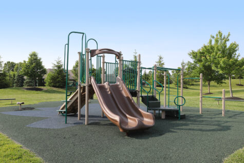 Palmera Apartments Playground with swings and slide.