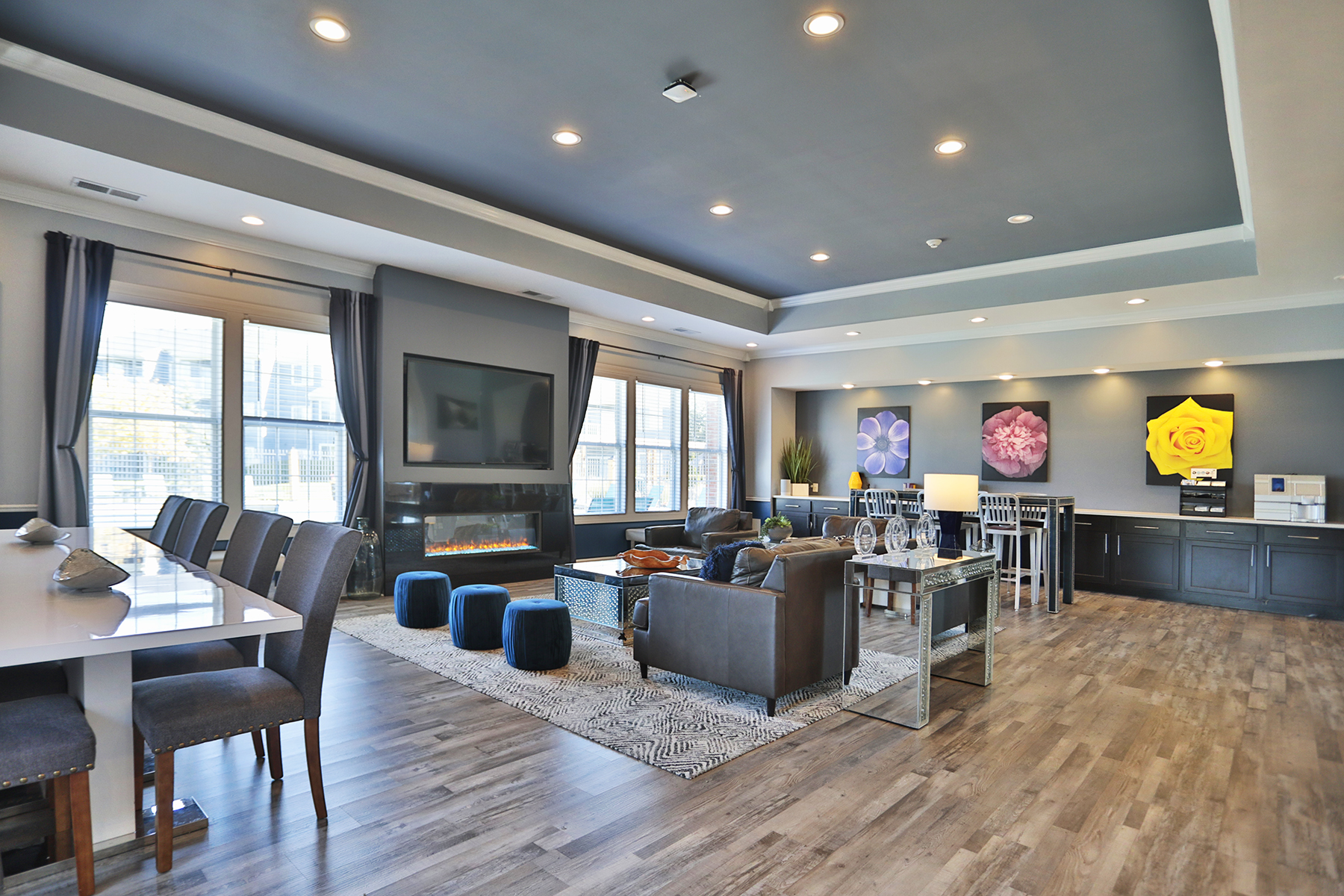 Sterling Lakes clubhouse offering cozy seating areas, a community workspace, and contemporary decor that blends comfort with sophistication.