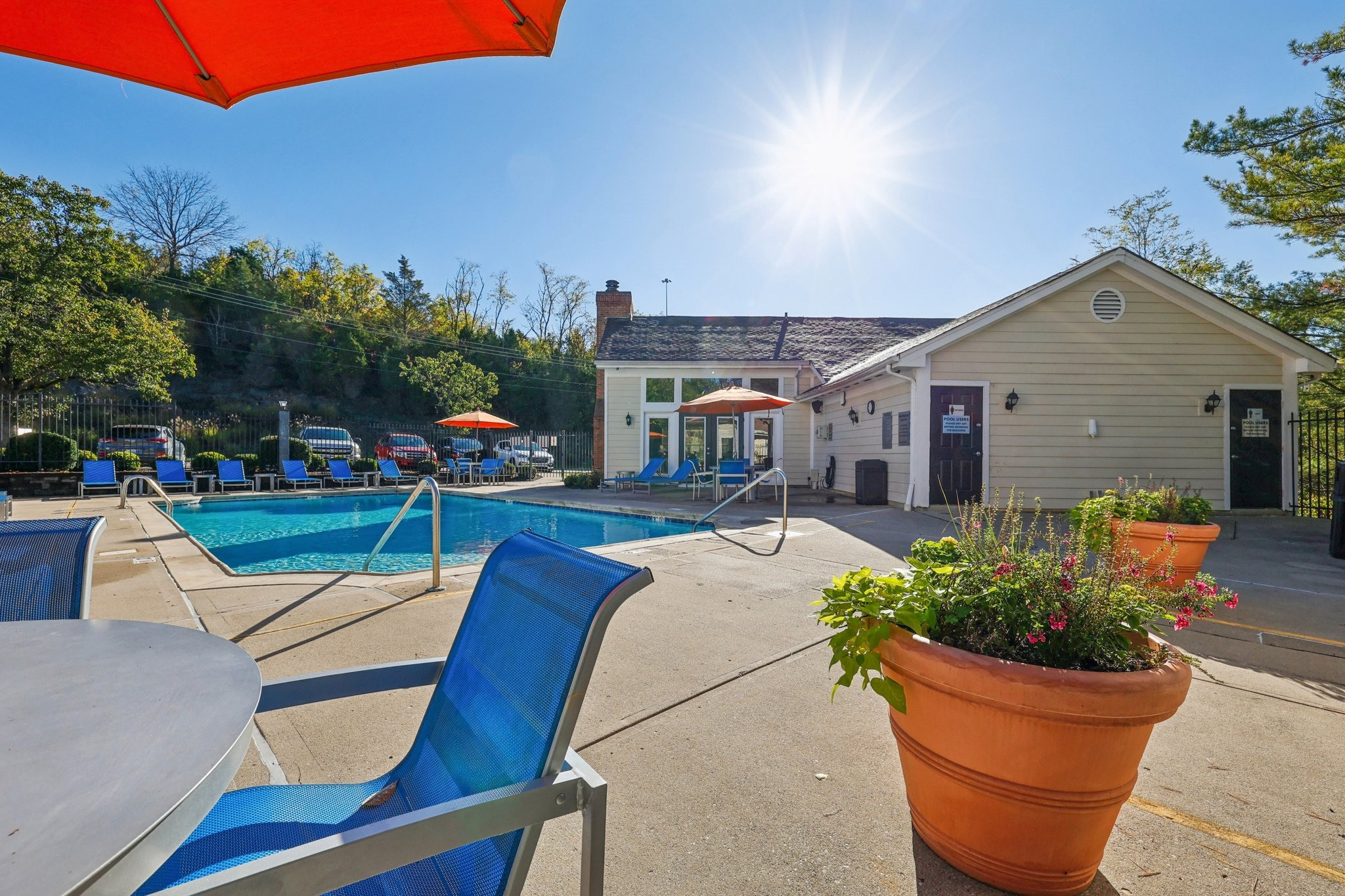 Outdoor pool with sundeck and lounge chairs near NKU and Cincinnati.