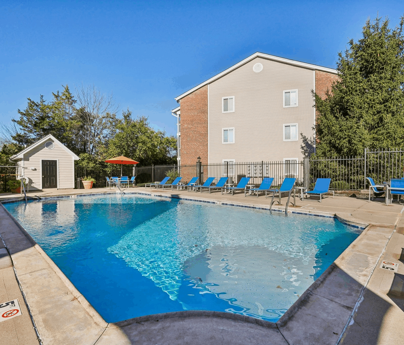 Refreshing pool area surrounded by greenery at Fox Chase South, Southgate, Kentucky.