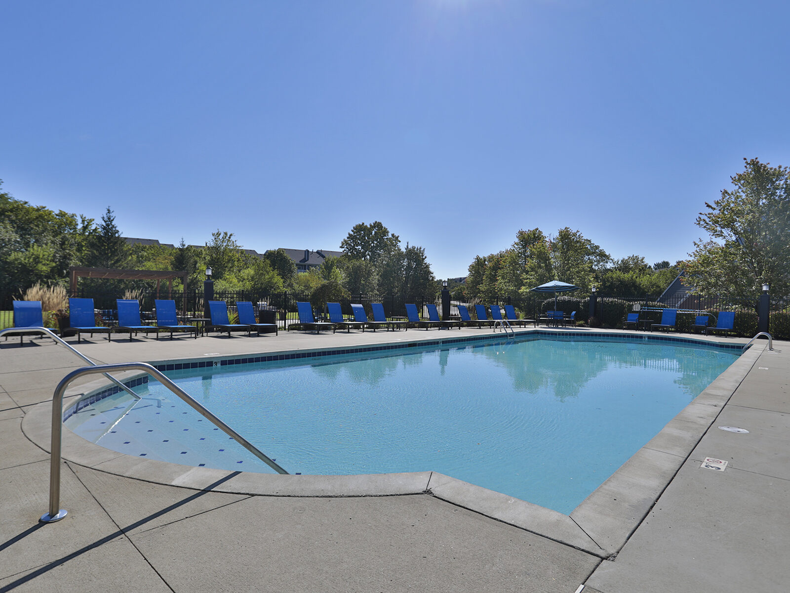 Waterford Place resort style swimming pool with sundeck and lounge chairs