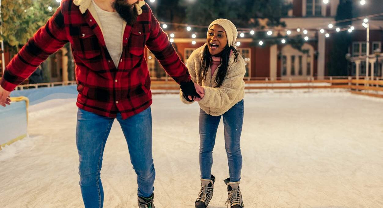 a couple ice skating