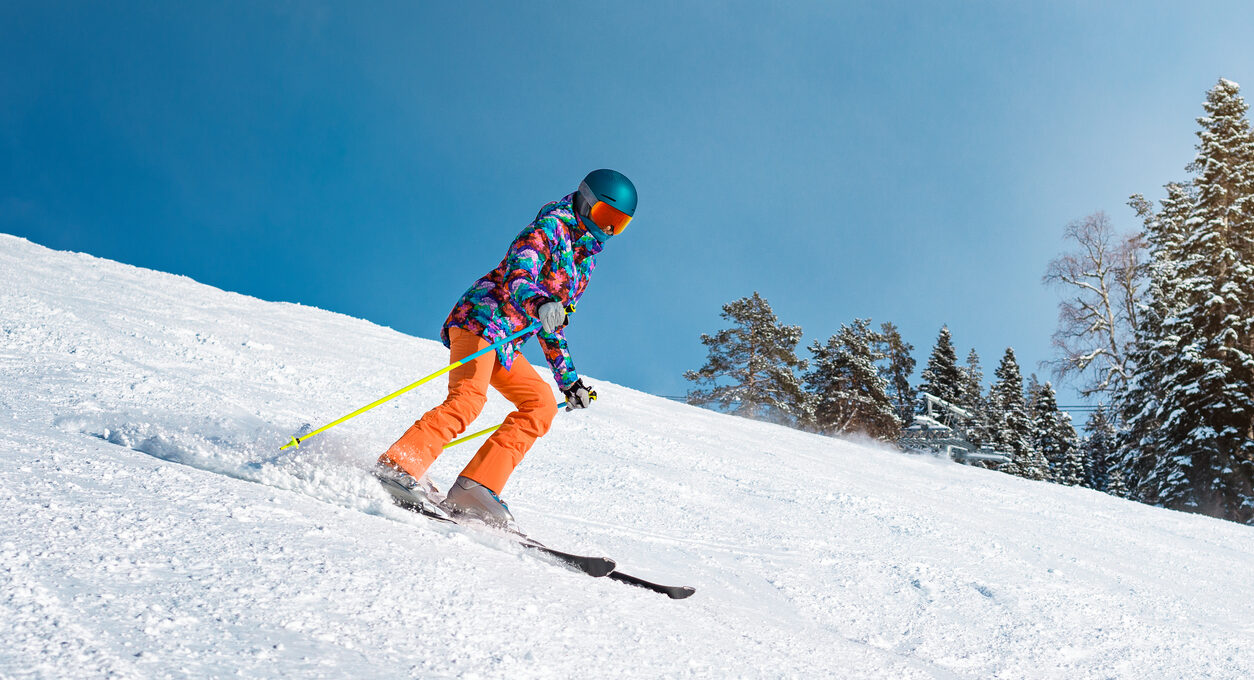 A skier going down the slopes
