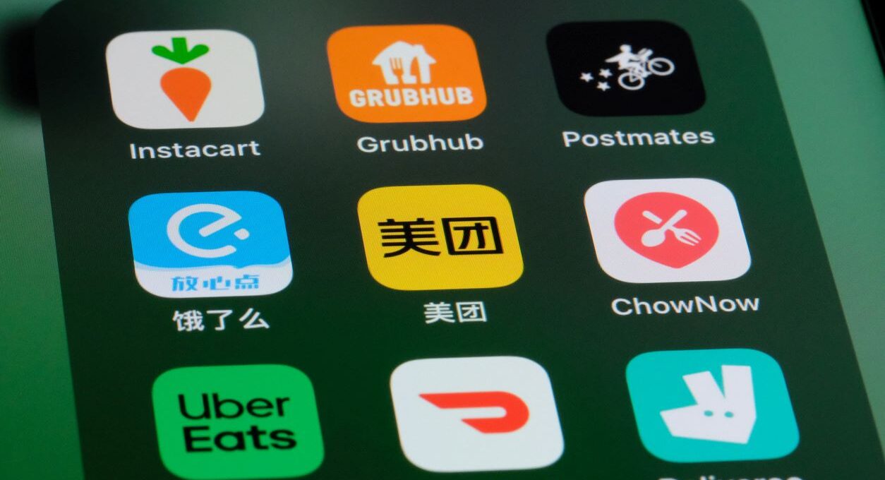 A phone app folder with a variety of food delivery service options